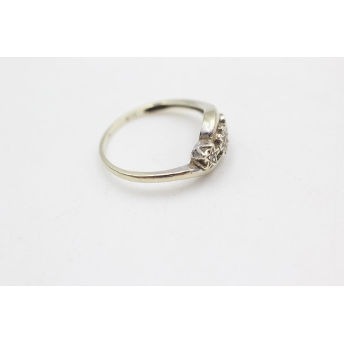 100 - A 9ct gold diamond three stone ring, size J½ - approx. gross weight 1.4 grams