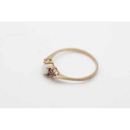 109 - A hallmarked London 9ct gold opal and ruby cluster ring, size P - approx. gross weight 1.1 grams