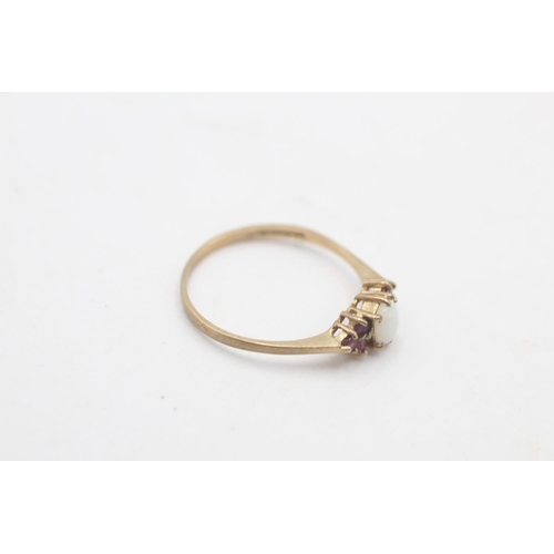 109 - A hallmarked London 9ct gold opal and ruby cluster ring, size P - approx. gross weight 1.1 grams