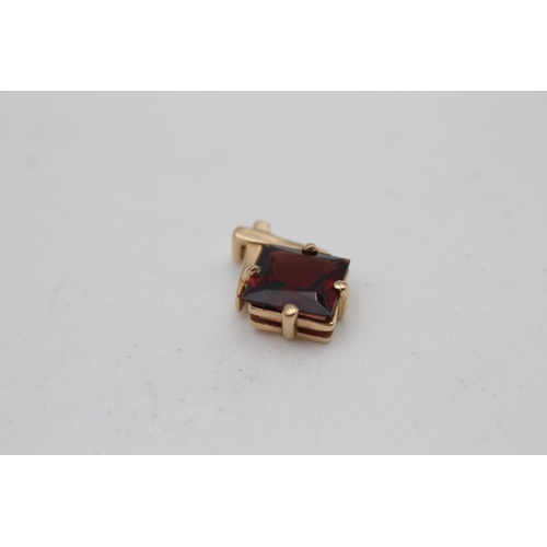 11 - A 9ct gold garnet and diamond French clip earrings and pendant set - approx. gross weight 6.6 grams