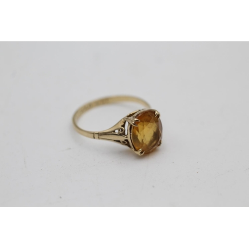 2 - Two 9ct gold gemstone solitaire cocktail rings, one citrine size M½ and one smoky quartz size L½ - a... 