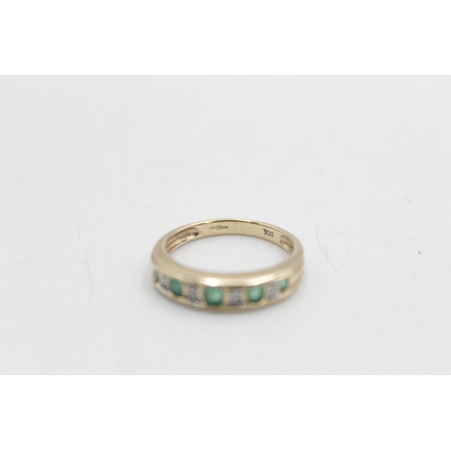 22 - A 9ct gold emerald and diamond half eternity ring, size L - approx. 2.1 grams