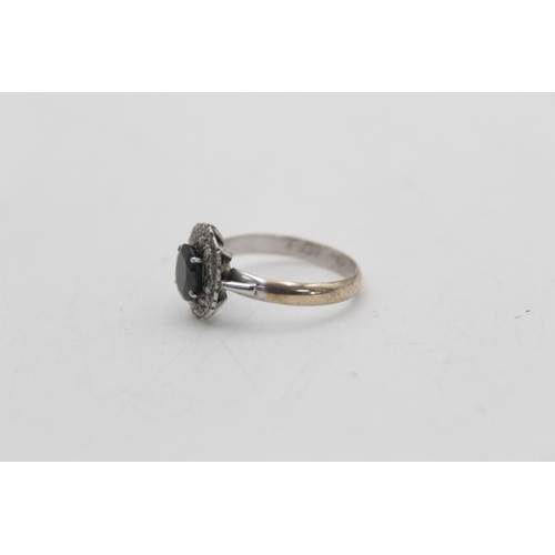 24 - A 9ct gold and silver sapphire and diamond halo dress ring with inner inscription, size Q½ - approx.... 