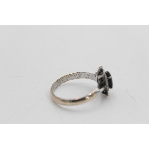 24 - A 9ct gold and silver sapphire and diamond halo dress ring with inner inscription, size Q½ - approx.... 