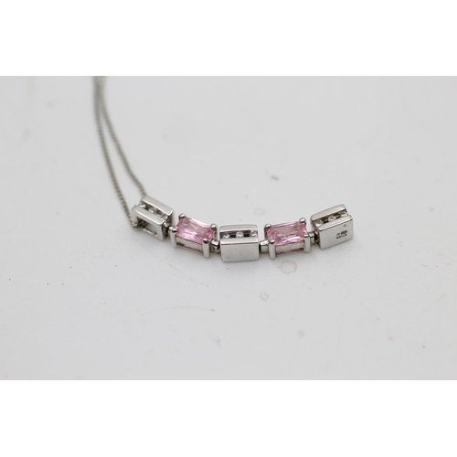 31 - A 9ct white gold clear and pink gemstone drop earrings and bar pendant necklace set - approx. gross ... 