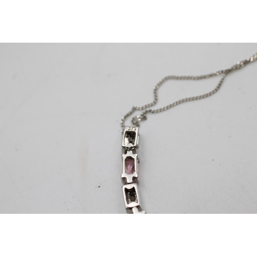 31 - A 9ct white gold clear and pink gemstone drop earrings and bar pendant necklace set - approx. gross ... 