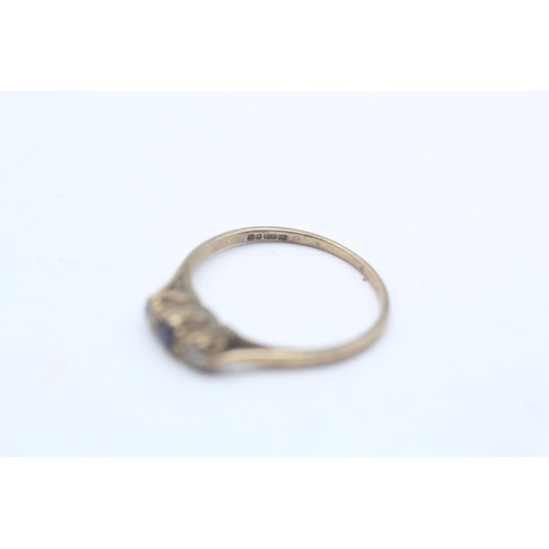 32 - A 9ct gold sapphire and clear gemstone three stone ring, size N½ - approx. gross weight 1.4 grams