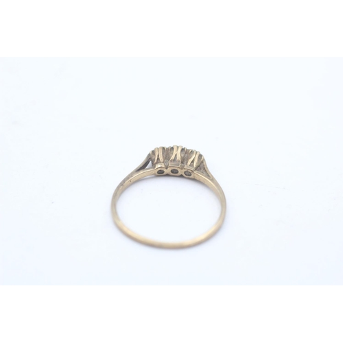 32 - A 9ct gold sapphire and clear gemstone three stone ring, size N½ - approx. gross weight 1.4 grams