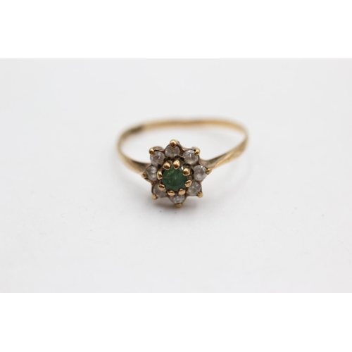 34 - A 9ct gold emerald and clear gemstone cluster ring, size O - approx. gross weight 1.2 grams