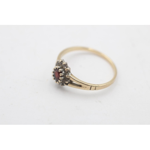 40 - A hallmarked Birmingham 9ct gold garnet and clear gemstone cluster ring, size P½ - approx. gross wei... 