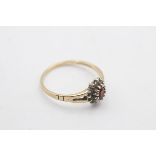 40 - A hallmarked Birmingham 9ct gold garnet and clear gemstone cluster ring, size P½ - approx. gross wei... 