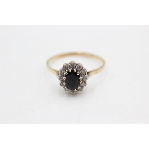 49 - A hallmarked Birmingham 9ct gold sapphire and clear gemstone cluster ring, size T - approx. gross we... 