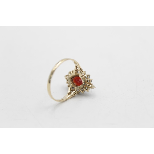 52 - A hallmarked Birmingham 9ct gold garnet and clear gemstone halo ring ,size R - approx. gross weight ... 