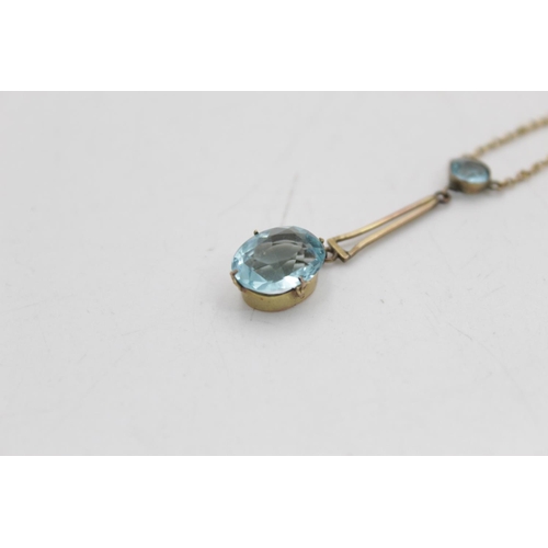 57 - An antique 9ct gold blue paste two stone lavalier pendant - approx. gross weight 1.5 grams