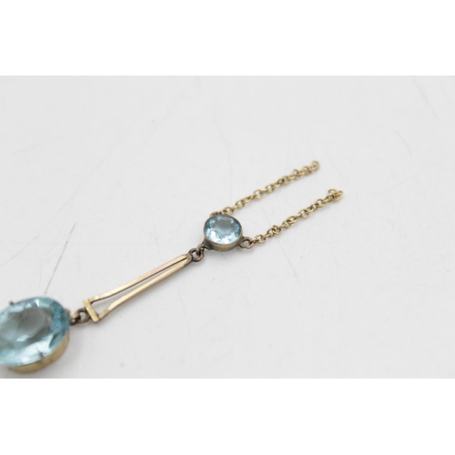 57 - An antique 9ct gold blue paste two stone lavalier pendant - approx. gross weight 1.5 grams