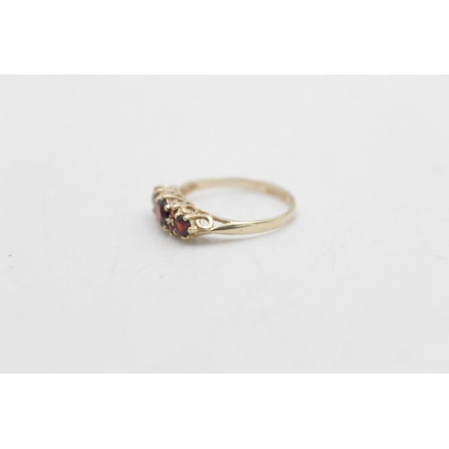 59 - A hallmarked Sheffield 9ct gold garnet gypsy ring, size N - approx. gross weight 1.4 grams