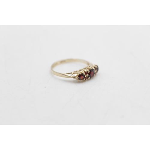 59 - A hallmarked Sheffield 9ct gold garnet gypsy ring, size N - approx. gross weight 1.4 grams