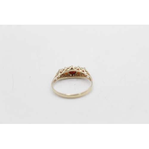 59 - A hallmarked Sheffield 9ct gold garnet gypsy ring, size N - approx. gross weight 1.4 grams