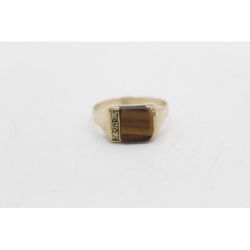 68 - A 9ct gold tigers eye and diamond signet ring, size U½ - approx. gross weight 2.9 grams