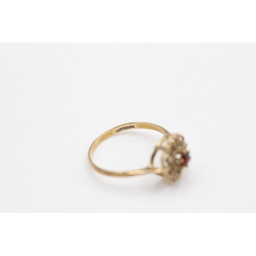 71 - A 9ct gold garnet and rock quartz floral cluster ring, size O½ - approx. gross weight 1.5 grams