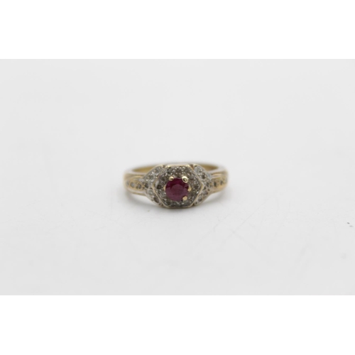 73 - A 9ct gold diamond and ruby dress ring, size L - approx. gross weight 3.3 grams