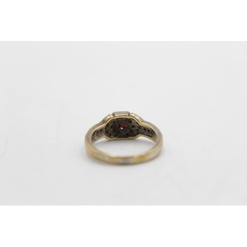 73 - A 9ct gold diamond and ruby dress ring, size L - approx. gross weight 3.3 grams