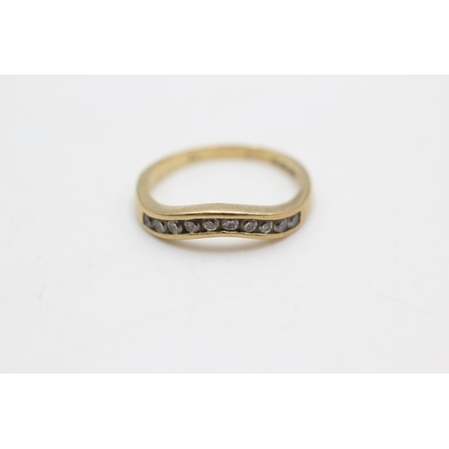 77 - A hallmarked 9ct gold clear gemstone wishbone ring, size L½ - approx. gross weight 1.9 grams