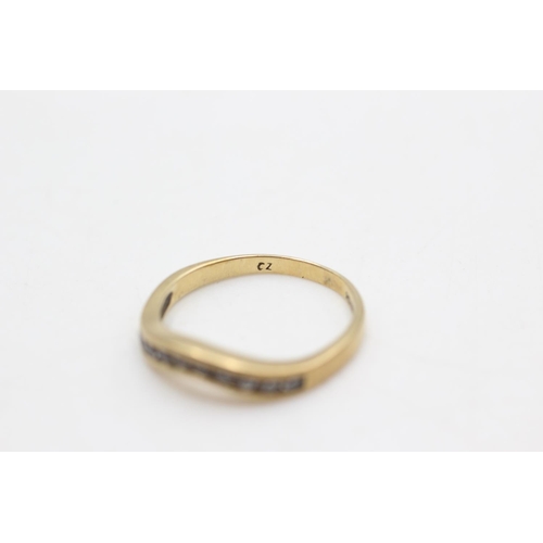 77 - A hallmarked 9ct gold clear gemstone wishbone ring, size L½ - approx. gross weight 1.9 grams