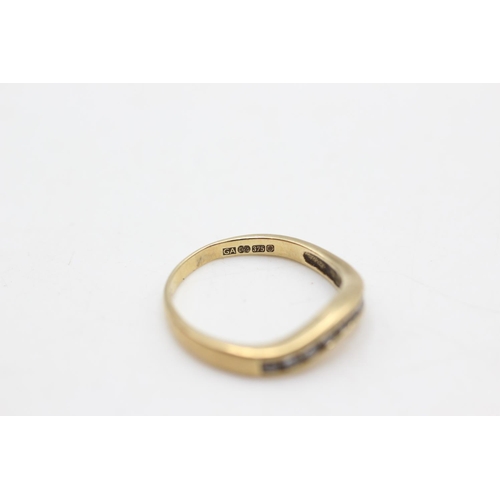 77 - A hallmarked 9ct gold clear gemstone wishbone ring, size L½ - approx. gross weight 1.9 grams