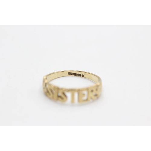 83 - A hallmarked Sheffield 9ct gold 'Sister' ring, size P - approx. gross weight 1.7 grams