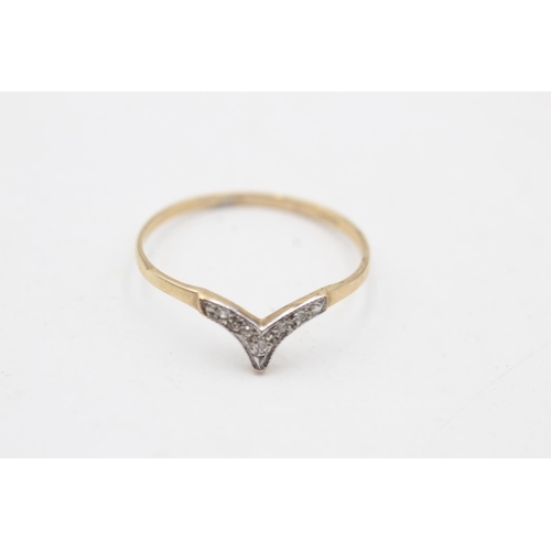 85 - A 9ct gold diamond wishbone ring, size S½ - approx. gross weight 0.8 grams