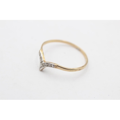 85 - A 9ct gold diamond wishbone ring, size S½ - approx. gross weight 0.8 grams