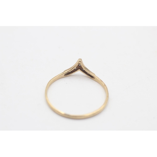 85 - A 9ct gold diamond wishbone ring, size S½ - approx. gross weight 0.8 grams