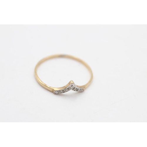 85 - A 9ct gold diamond wishbone ring, size S½ - approx. gross weight 0.8 grams