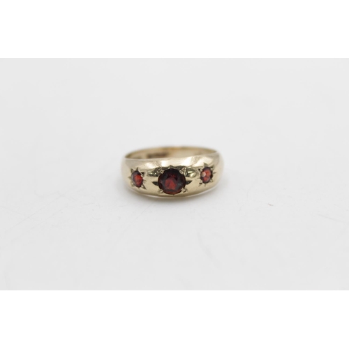 90 - A hallmarked Birmingham 9ct gold garnet gypsy ring, size M - approx. gross weight 2.9 grams