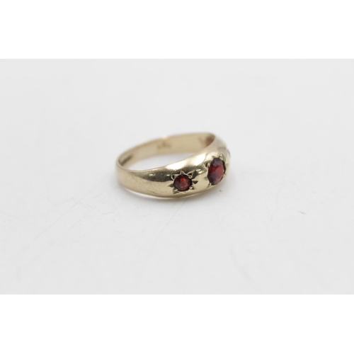 90 - A hallmarked Birmingham 9ct gold garnet gypsy ring, size M - approx. gross weight 2.9 grams