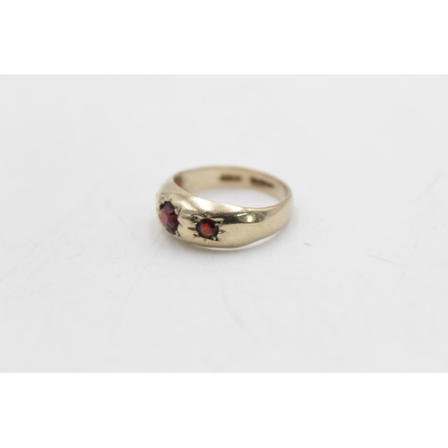 90 - A hallmarked Birmingham 9ct gold garnet gypsy ring, size M - approx. gross weight 2.9 grams