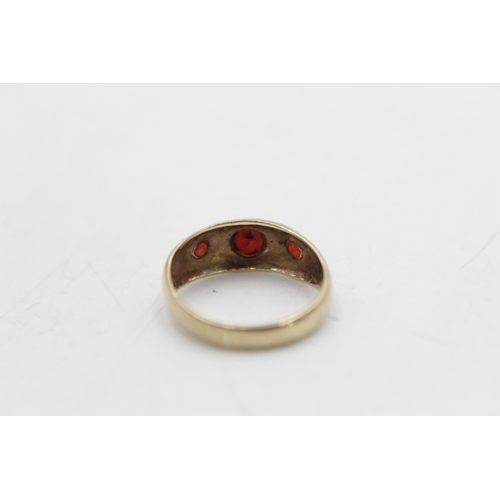 90 - A hallmarked Birmingham 9ct gold garnet gypsy ring, size M - approx. gross weight 2.9 grams