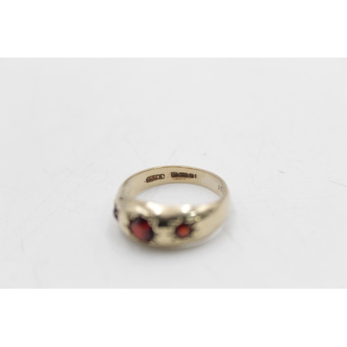 90 - A hallmarked Birmingham 9ct gold garnet gypsy ring, size M - approx. gross weight 2.9 grams