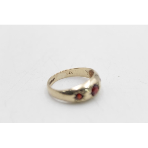 90 - A hallmarked Birmingham 9ct gold garnet gypsy ring, size M - approx. gross weight 2.9 grams