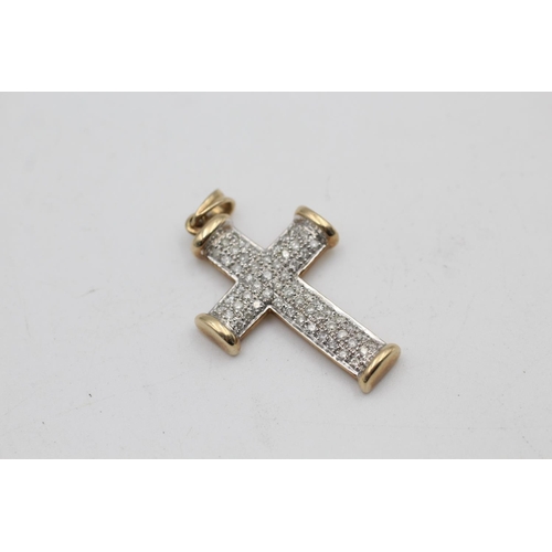 91 - A 9ct gold diamond cross pendant - approx. gross weight 7.5 grams