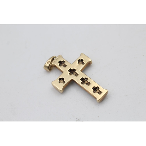 91 - A 9ct gold diamond cross pendant - approx. gross weight 7.5 grams