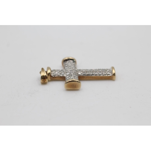 91 - A 9ct gold diamond cross pendant - approx. gross weight 7.5 grams