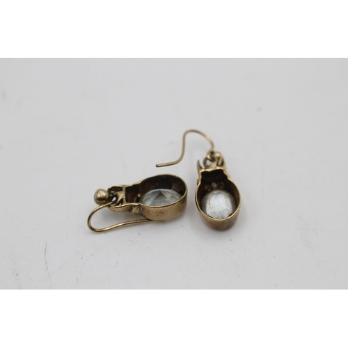 92 - A pair of 9ct gold topaz and diamond French wire drop earrings - approx. gross weight 2.7 grams