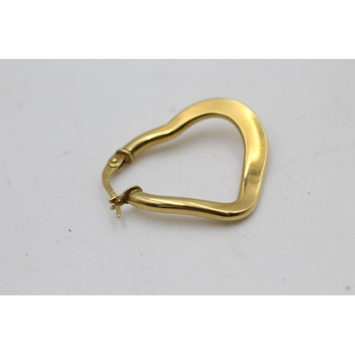 93 - A pair of 9ct gold heart shaped hoop earrings - approx. gross weight 3.8 grams