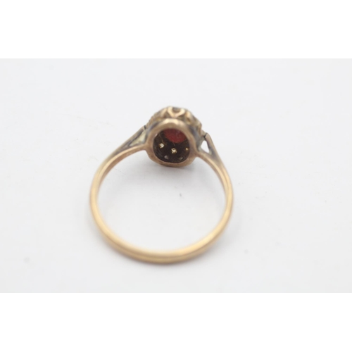 95 - A hallmarked Birmingham 9ct gold garnet and clear gemstone cluster ring, size R - approx. gross weig... 