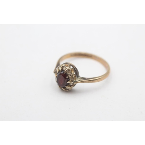 95 - A hallmarked Birmingham 9ct gold garnet and clear gemstone cluster ring, size R - approx. gross weig... 