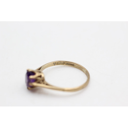 96 - A hallmarked Birmingham 9ct gold amethyst cathedral set solitaire ring, size P - approx. gross weigh... 