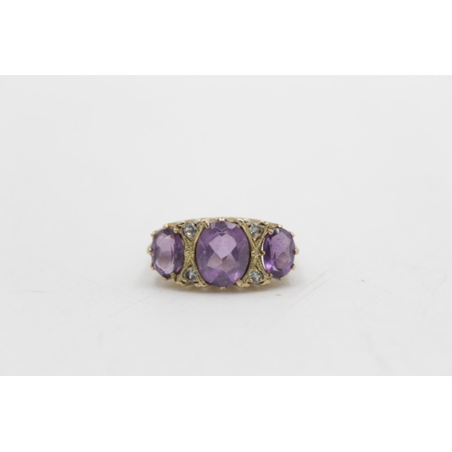 97 - A hallmarked London 9ct gold amethyst and clear gemstone gypsy ring, size P - approx. gross weight 4... 