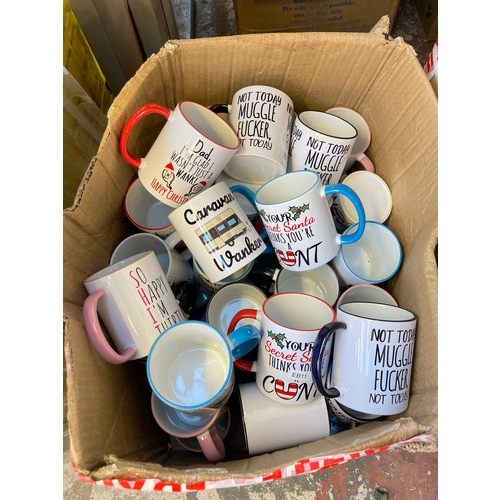 1609 - Two boxes containing assorted novelty mugs